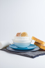 Small wooden brush. Dish cleenign brush. Dirty boots cleaning brush. brush on plate. Small cleaner for cleaning dirty dishes.