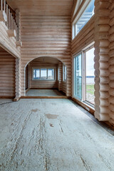 A two-story wooden cottage from the inside out in coniferous spruce pine green forest