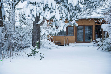 Trees covered by snow at rural house, Bavaria, Germany