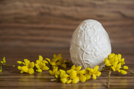 Close-up of an Easter egg with yellow flowers