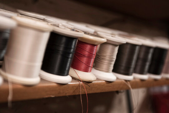 Variety of yarn bobbins in a cobbler's shop