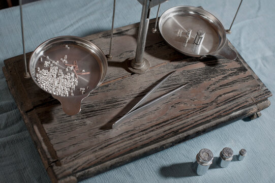 High angle view of silvers with copper on scales in workshop, Bavaria, Germany