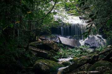 Natural scene of waterfall inside tropical rainforest after rainfall.
