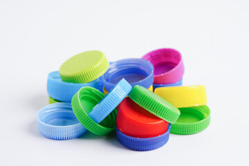 Plastic bottle caps colorful for recycle on white background.