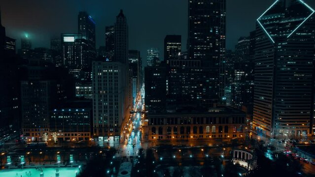 Cyberphunk night chicago in the winter aerial 4k. Crain Communications Building and other famous buildings in background. United States