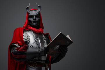 Portrait of evil knight with book dressed in red robe and plate armor.