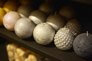 Beautiful decorative candles on the shelf