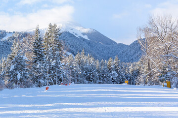 Bansko, Bulgaria perspective of ski road slope and mountain peak in winter after snowfall