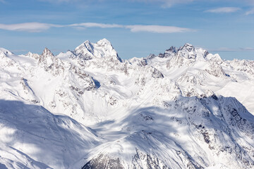 Snowy mountains with blue sky above. Solden in the Austrian Alps - obrazy, fototapety, plakaty