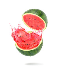 Fresh watermelon cut in half with juice splash isolated on white background.