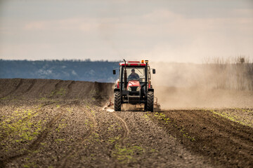 The promise of spring, tractor readying the fields for a new season of growth