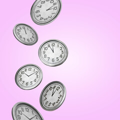 Many clocks falling on pink background. Space for text
