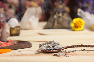 Sage in Vintage Spoon on Meditation Altar With Pyramid in Background
