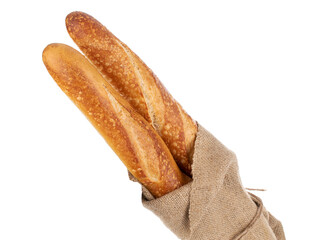 Two aromatic baguettes in jute bag, macro isolated on white background.