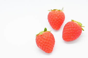 beautiful three fresh red strawberry isolated on white background