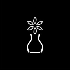 Minimalist vase with flowers isolated on black background.
