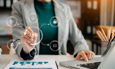 AML Anti Money Laundering Financial Bank Business Concept. judge in a courtroom using laptop and tablet with AML anti money laundering icon on virtual  screen. .