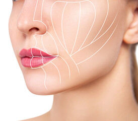 Graphic lines shows face lifting effect on young female face.