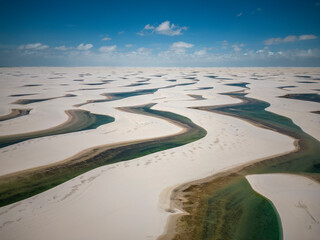 Beautiful aerial view to white sand dunes and green rainwater pools