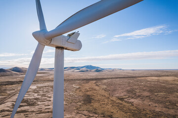 A wind turbine producing clean energy in the New Mexico desert