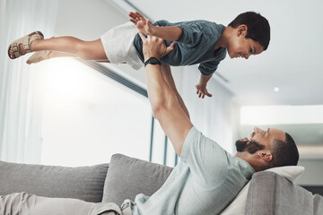 Relax, smile and lifting with father and son on sofa of living room for bonding, playful and...
