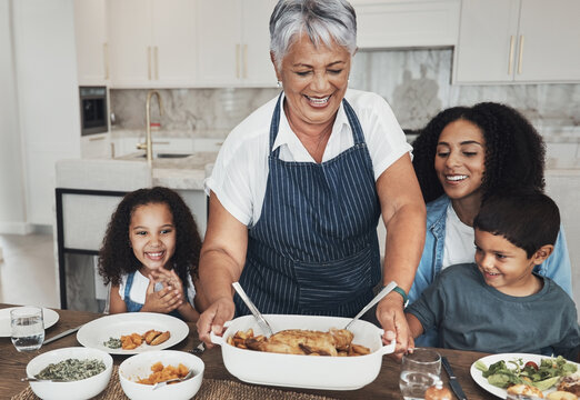 Grandmother, Family Home And Kids At Table For Food, Lunch Or Celebration With Love, Care And Happiness. Black People, Senior Woman And Children With Dinner, Party And Happy For Bonding In Kitchen