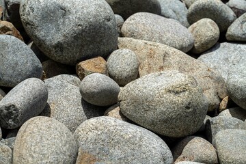 round rocks and pebbles on the beach in australia