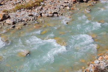 River at the foot of the mountains.