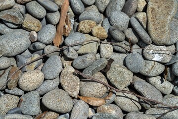 round rocks and pebbles on the beach in australia