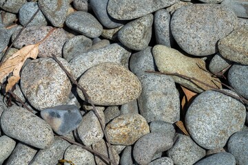 round rocks and pebbles on the beach in australia