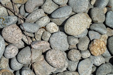 round rocks and pebbles on the beach in australia
