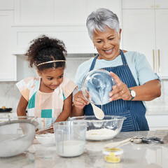 Learning, cooking and grandmother with girl in kitchen mixing milk and flour in bowl. Education, family care and happy grandma teaching child how to bake, bonding and enjoying baking time together.