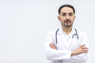 Photo of male mature doctor posing at camera with a stethoscope.