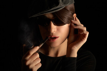 woman smoking pipe. Smoking lady with a vintage wooden pipe.