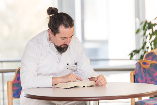 Doctor Reads A Book During Lunch Break