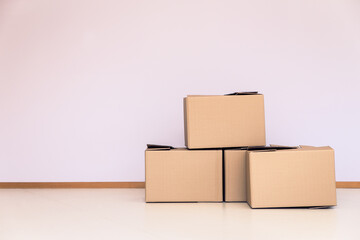 moving boxes in front of a empty wall, copyspace