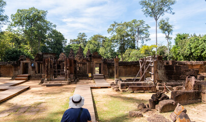 An undefined tourist walk at Banteay Srei temple, Angkor Wat, Siem Reap. Cambodia