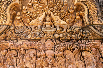 Fototapeta na wymiar Beautiful carving bas-relief at Banteay Srei temple, Angkor Wat, Siem Reap. Cambodia