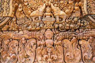 Fototapeta na wymiar Beautiful carving bas-relief at Banteay Srei temple, Angkor Wat, Siem Reap. Cambodia