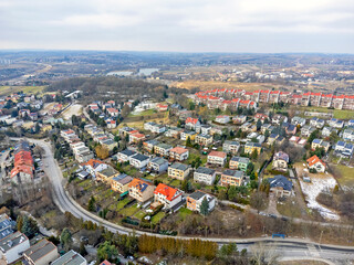 Obraz premium Aerial view landscape. Buildings, houses, bungalow estate, roofs and streets. 