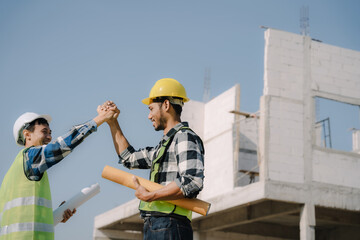 Team architects workers, men and women, join hands to join forces to join forces to work for the industry for success. Teamwork and professional colleagues : Workers' hands, teamwork concept.