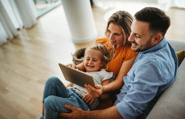 Device technology family online education concept. Happy family with digital devices at home.
