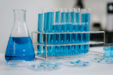 cience lab test tubes, lab equipment.