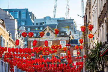 Chinatown with red Chinese lanterns hanging above the street of Soho in London, England