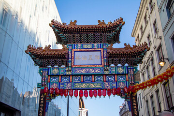 Chinatown entrance gate in traditional Chinese design in London, England, United Kingdom. "China, Peace, Security" (Zhong guo tai ping) is written on the gate in Chinese characters