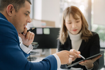 Project manager working and update tasks with milestones progress planning and professional investor working new start up project in the office.