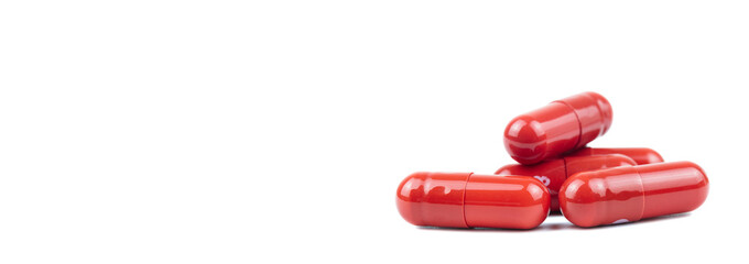 Large pill shot in a studio environment, isolated on white.