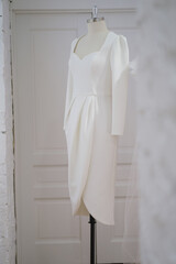 Elegant dress in the wedding salon. The choice of wedding dresses in the store