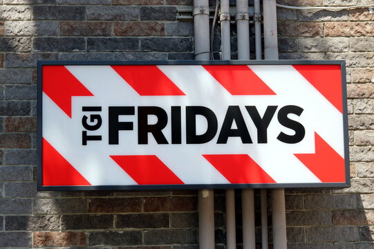 TOKYO, JAPAN - June 13, 2019: A sign on the wall of a TGI Fridays restaurant in Tokyo's Omotesando area.