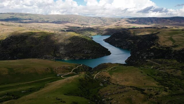 Iconic New Zealand landscape with river and mountains, aerial view